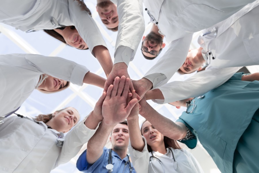 Medical Professionals putting their hands together