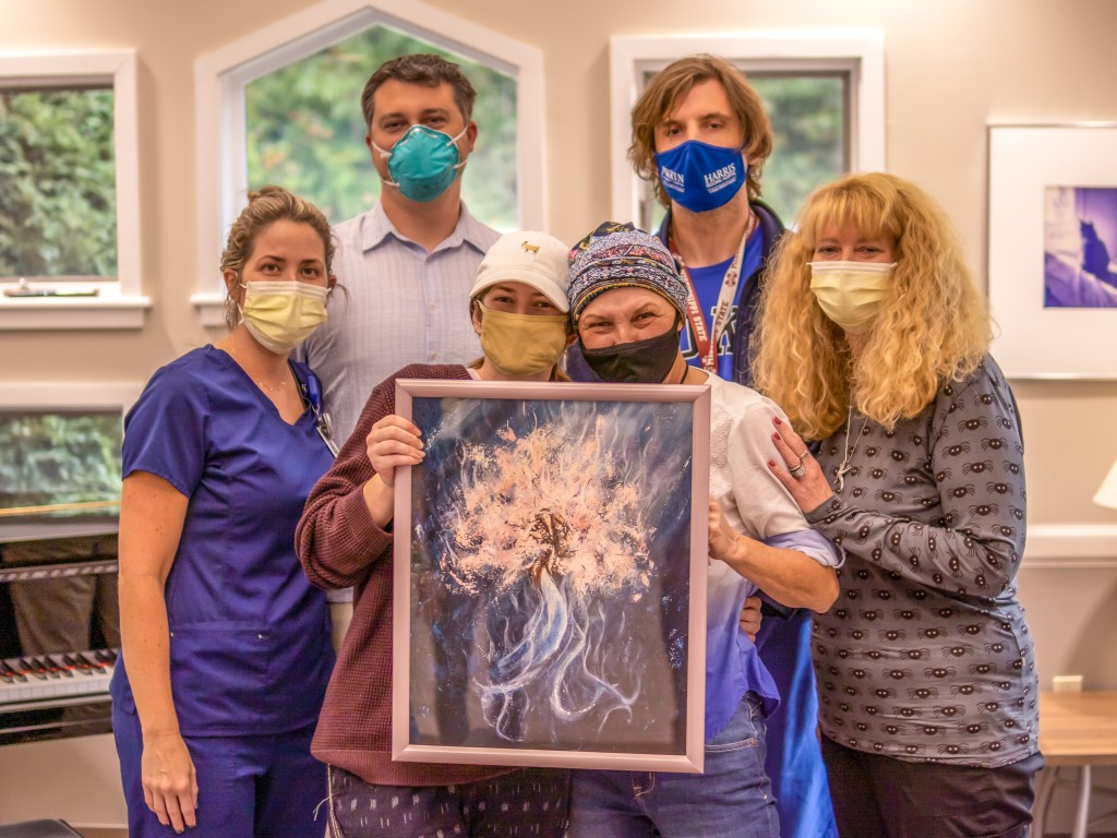Lung Cancer Awareness Month: Lung cancer patient receives painting from western carolina university artist found in Harris Cancer Center halls.
